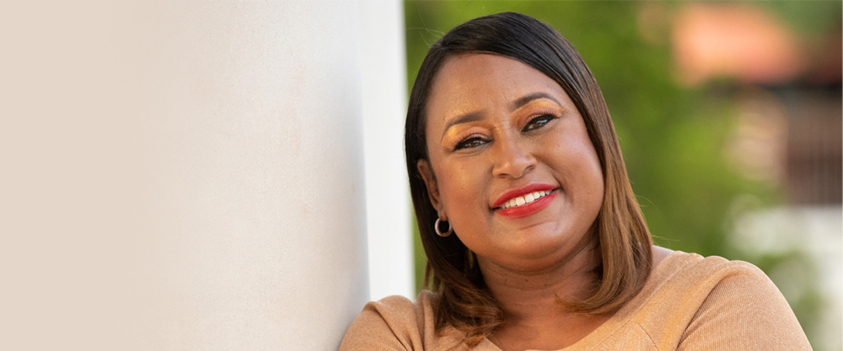 Photo of a woman with satisfactory smile.